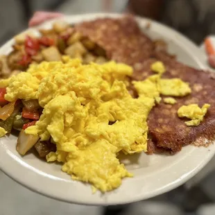a plate of scrambled eggs and sausage
