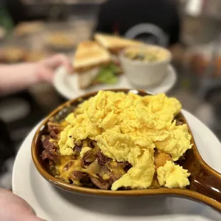 a person holding a plate of food