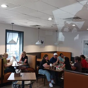 a group of people eating in a restaurant