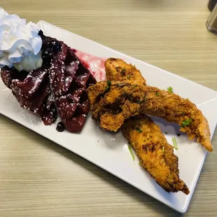 Fried chicken and waffle **substituted red velvet waffle with blueberry compote