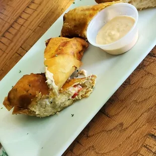 Crab cheese steak egg rolls.