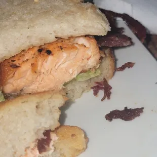 The unseasoned extremely over cooked salmon on dry bread with the drop of mayo.