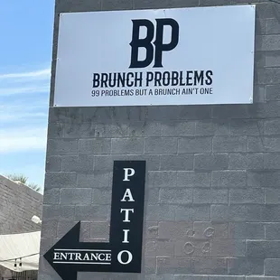 a sign for patio entrance