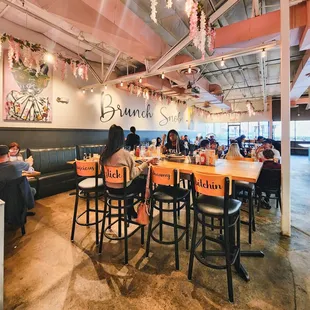 people sitting at tables in a restaurant