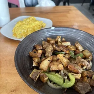 A side of scrambled eggs and hash browns. The hash browns were a little hard. The eggs were good.