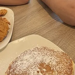 Chicken and waffles, pancakes, eggs, and bacon.