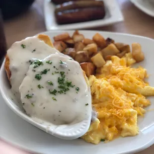 Sausage and biscuits, scrambled eggs with cheddar and home fries.