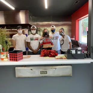 a group of people wearing masks