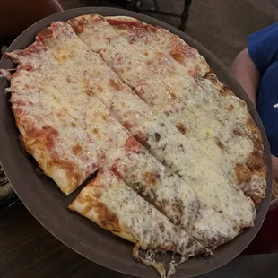 Half apple butter and half cheese pizza