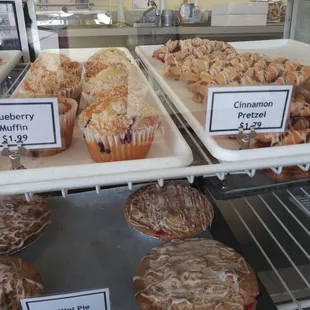 Blueberry muffins, cinnamon pretzels and mini pie.