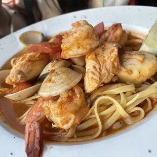 a plate of shrimp and pasta