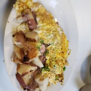 an omelet and potatoes on a plate