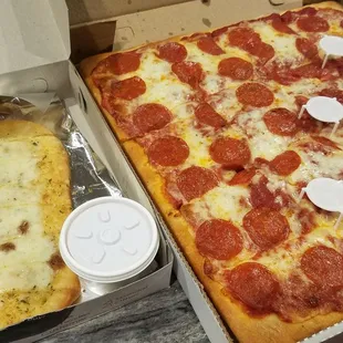 Breadsticks with cheese (dipping marinara was TO DIE FOR) and Sicilian style pepperoni pizza