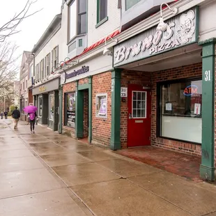 people walking down the sidewalk