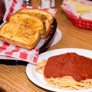a plate of spaghetti and toast