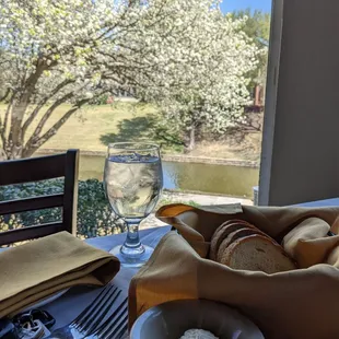 a bowl of bread and a glass of water