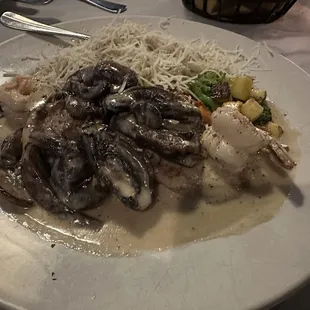 BRUNO'S SPECIAL Veal, chicken &amp; shrimp in a brandy portobello mushroom cream sauce