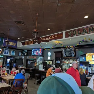 people sitting at tables in a restaurant
