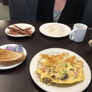 Gravy and biscuits. Bacon. Western omelette. Rye toast.