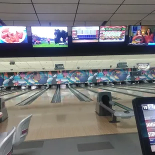 Lanes with speakers and TVs.