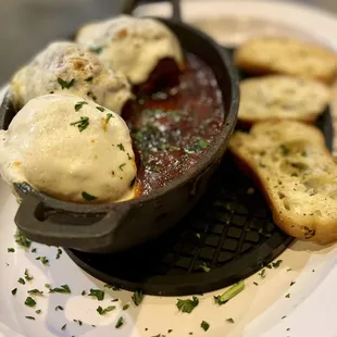 Meatballs in marinara... decent flavor, meatballs crumbled more than we&apos;d prefer. Great presentation