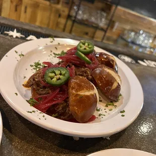 Short-rib sliders... pickled onions added some sweetness. Good tasting bun combo.