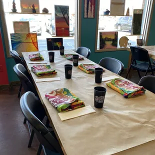 Set up of aprons and water for painting