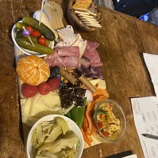 a platter of food on a wooden table