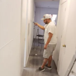 Here is the owner, David. Scraping the paperwall off the walls.