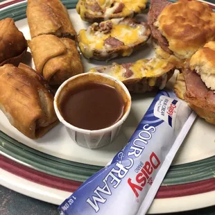 Sampler with BBQ crunchers, potato skins, and ham biscuits.