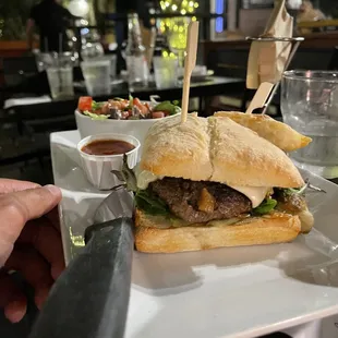 a sandwich with a side of salad