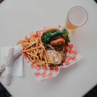 a burger and fries on a table