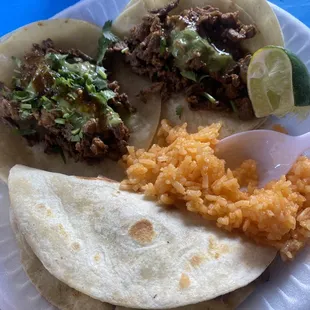 Carne Asada tacos and a chicken quesadilla w/ rice
