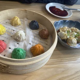 Soup dumplings on left Spicy dumplings in chili oil to the right