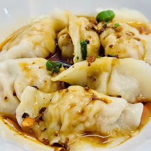 Pork dumplings in chili oil is always a must