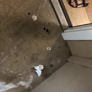 Cigarette butts, glass, nails and screws, used tissue, gum and bottle caps found outside our door.