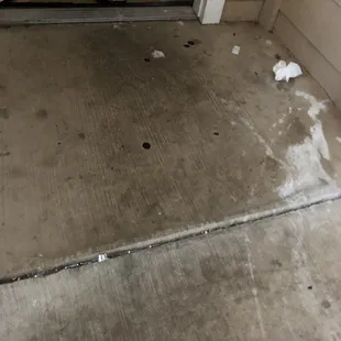 Our front door entrance. Caked in mold, used tissue, glass, rusty nails and gum.