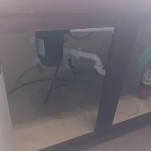 Stains found under the sink discovered during our move-in.