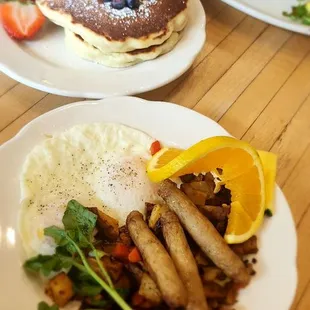 2 Eggs and Sausage. A side of pancakes. Chorizo skillet in the far back. Everything was delish!