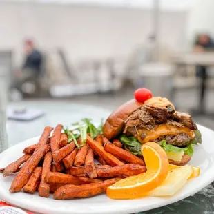 Burger with pulled pork and sweet potato fries