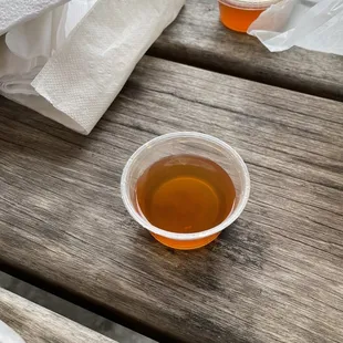 a cup of tea on a picnic table