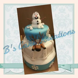 a cake with a snowman on top