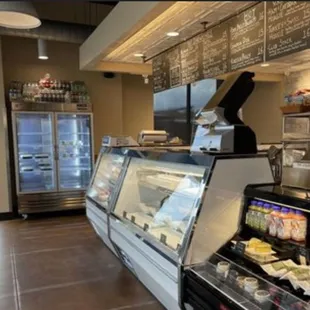Front counter with fresh meats, cheese, and other food.