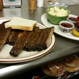 a plate of ribs and sides