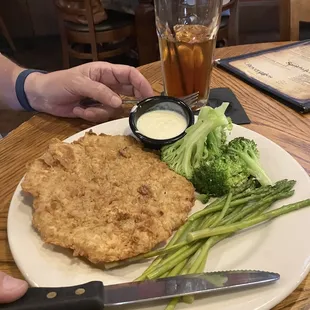 Chicken fried steak with broccoli and asparagus