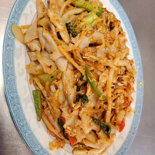 a plate of stir fried noodles