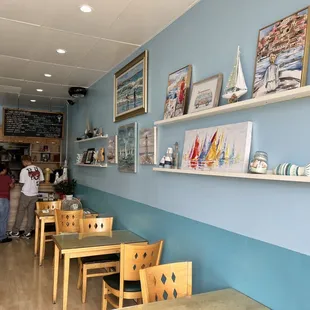 two people standing in a restaurant