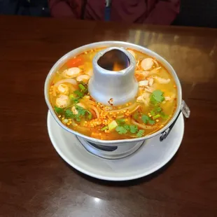 Tom Yum soup. Served boiling hot and awesome flavor!