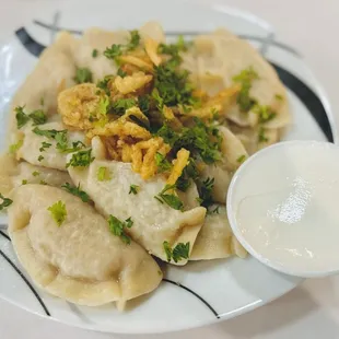 Vareniki (Potato and Onion Dumpling) with a side of sour cream