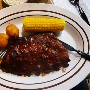 Ribs, corn on the cob, and delicious hush puppies.